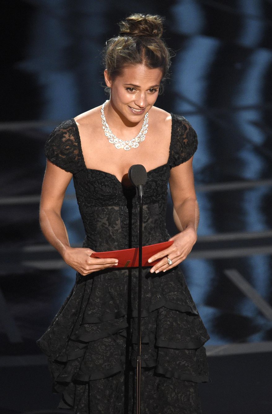 Alicia Vikander presents the award for best actor in a supporting role at the Oscars on Sunday, Feb. 26, 2017, at the Dolby Theatre in Los Angeles. (Photo by Chris Pizzello/Invision/AP)