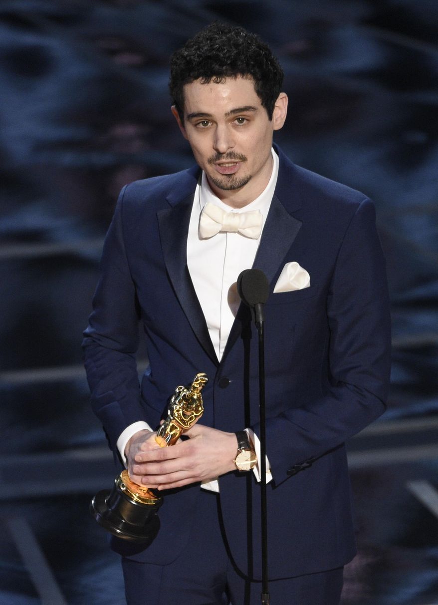 Damien Chazelle accepts the award for best director for "La La Land" at the Oscars on Sunday, Feb. 26, 2017, at the Dolby Theatre in Los Angeles. (Photo by Chris Pizzello/Invision/AP)