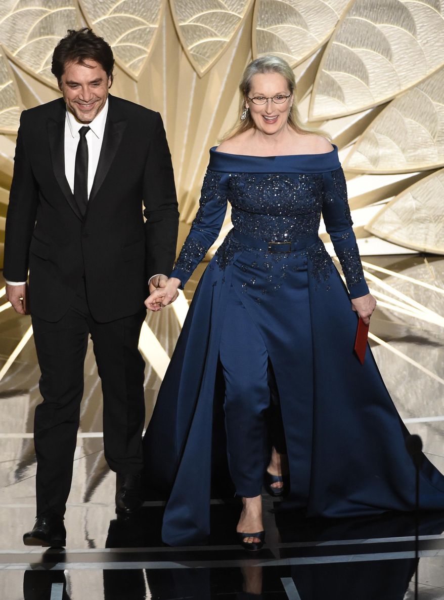Javier Bardem, left, and Meryl Streep present the award for best cinematography at the Oscars on Sunday, Feb. 26, 2017, at the Dolby Theatre in Los Angeles. (Photo by Chris Pizzello/Invision/AP)
