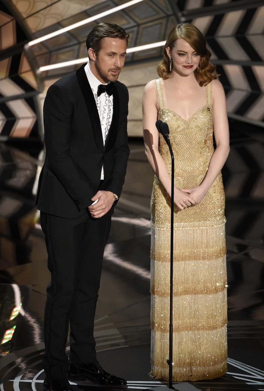 Ryan Gosling, left, and Emma Stone introduce a performance at the Oscars on Sunday, Feb. 26, 2017, at the Dolby Theatre in Los Angeles. (Photo by Chris Pizzello/Invision/AP)