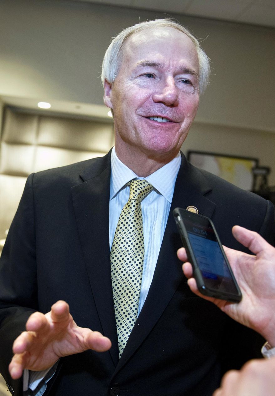 FILE - In this Feb. 25, 2017, file photo, Arkansas Gov. Asa Hutchinson speaks with a reporter in Washington. On Monday, Feb. 27, 2017, Hutchinson scheduled execution dates for eight inmates in an attempt to resume the death penalty after a nearly 12-year hiatus, even though the state lacks one of three drugs needed to put the men to death. (AP Photo/Cliff Owen, File)