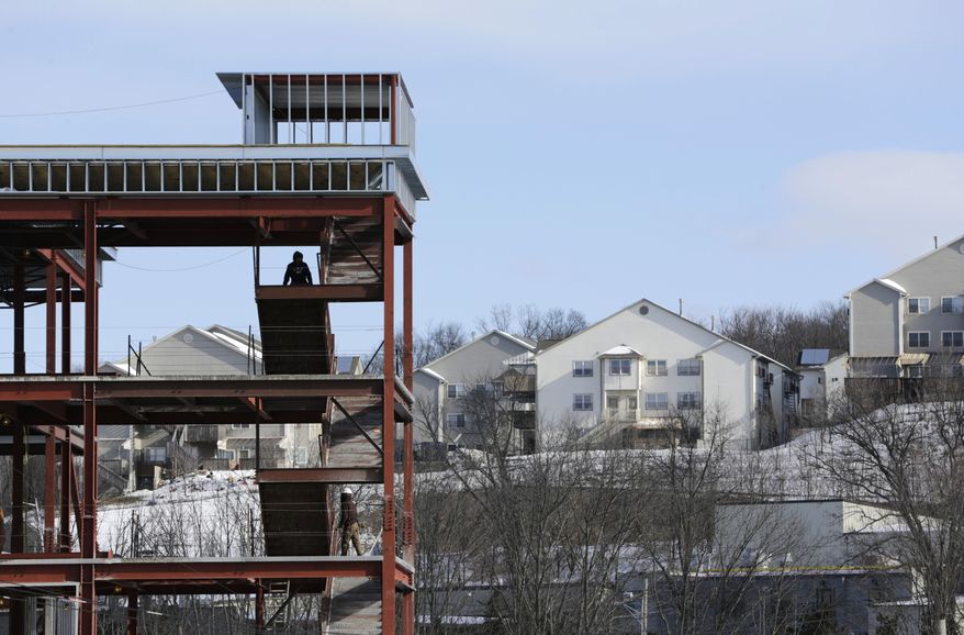 This Feb. 16, 2017 photo shows new construction, a frequent sight in Kiryas Joel, N.Y. The insular Hasidic Jewish village wants to expand, raising tensions with neighbors who fear the growth could overrun their slice of suburbia. They fear an expansion of the village’s urban-style development could disrupt the hilly area 50 miles northwest of New York City. (AP Photo/Seth Wenig)