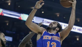 FILE - In this Dec. 15, 2016, file photo, New York Knicks&#39; Joakim Noah, right, shoots against Golden State Warriors&#39; Draymond Green, center, and JaVale McGee during the first half of an NBA basketball game in Oakland, Calif. Brandon Jennings is gone and Joakim Noah is headed for knee surgery. If the New York Knicks are going to make a playoff push, it will come without two of the key veterans they signed last summer.(AP Photo/Ben Margot, File)