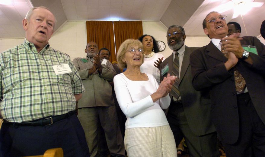 FILE- In this June 20, 2004, file photo, former Neshoba County Democrat newspaper publisher Stanley Dearman, left, Carolyn Goodman, mother of slain 1964 civil rights worker Andrew Goodman, center, and former Student Nonviolent Coordinating Committee member David Dennis, right, join other civil rights veterans during a program commemorating the 40th anniversary of the deaths of three civil rights workers at Mount Zion United Methodist Church in Philadelphia, Miss. Dearman, who pushed for justice in the murders of three civil rights workers, died on Saturday, Feb. 25, 2017, in Florida. (AP Photo/Rogelio Solis, File)