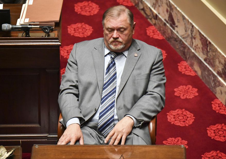 Minority Leader Tom Bakk sits quietly after his passionate speech opposing the Sunday Liquor bill Monday, Feb. 27, 2017, in St. Paul, Minn. The Minnesota Legislature has voted to repeal the state's long-standing ban on Sunday liquor sales. The state Senate passed a bill undoing the Prohibition-era ban on a 38-28 vote Monday. (Glen Stubbe/Star Tribune via AP)