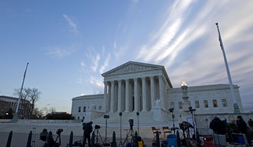 FILE - In this Feb. 1, 2107 file photo, members of the media gather outside the Supreme Court in Washington. With a nod to the importance of social media in American life, the Supreme Court signaled Monday, Feb. 27, 2017, it could strike down a North Carolina law that bars convicted sex offenders from Facebook, Twitter and other popular sites. (AP Photo/Jose Luis Magana, File)