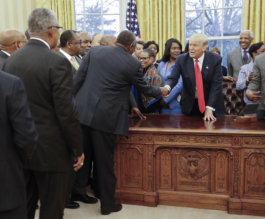 President Donald Trump shakes hands as he meets with leaders of Historically Black Colleges and Universities (HBCU) in the Oval Office of the White House in Washington, Monday, Feb. 27, 2017. (AP Photo/Pablo Martinez Monsivais)