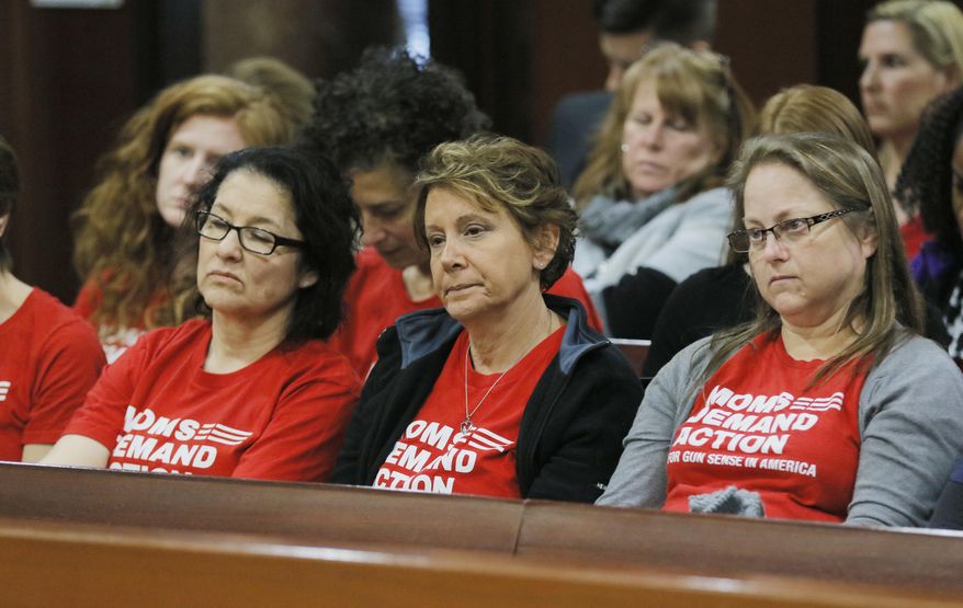 Woman from the group Moms Demand Action watch as the campus Carry bill advances Monday, Feb. 27, 2017, at the legislature in Atlanta. With little fanfare, the House Public Safety and Homeland Security Committee om Monday approved what has become known as the "Campus Carry" bill. Ballinger is the sponsor of HB 280, which allows anyone with a Georgia weapons permit to carry firearms onto most parts of public college and university campuses. (Bob Andres/Atlanta Journal-Constitution via AP)