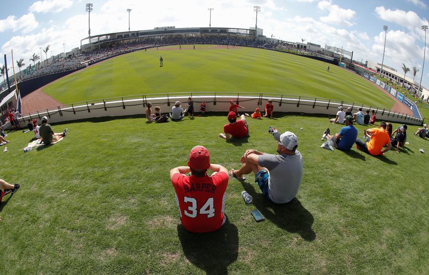 Fans enjoy the view from outfield during the spring training game between Washington Nationals and Houston Astros at newly opened The Ballpark of the Palm Beaches in West Palm Beach, Florida, on Tuesday. (Associated Press)