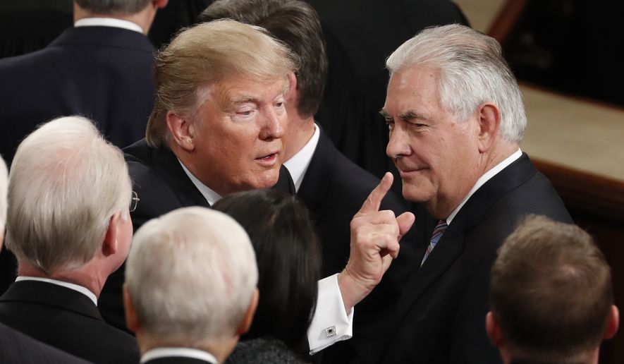 President Donald Trump gestures as he passes Secretary of State Rex Tillerson as he leaves Capitol Hill in Washington, Tuesday, Feb. 28, 2017, following his address to a joint session of Congress. (AP Photo/Alex Brandon) ** FILE **