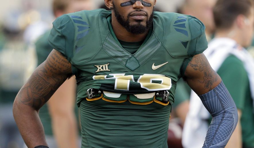 This Oct. 15, 2016 photo shows Baylor defensive back Travon Blanchard (48) walking along the sideline during an NCAA college football game against Kansas in Waco, Texas. Blanchard has been suspended after the school was notified that a protective order had been issued against him. The Baylor athletic department released a statement Tuesday, Feb. 28, 2017 saying it was aware of the complaint made by a woman against Blanchard through the McLennan County District Attorney’s Office. (AP Photo/Tony Gutierrez)