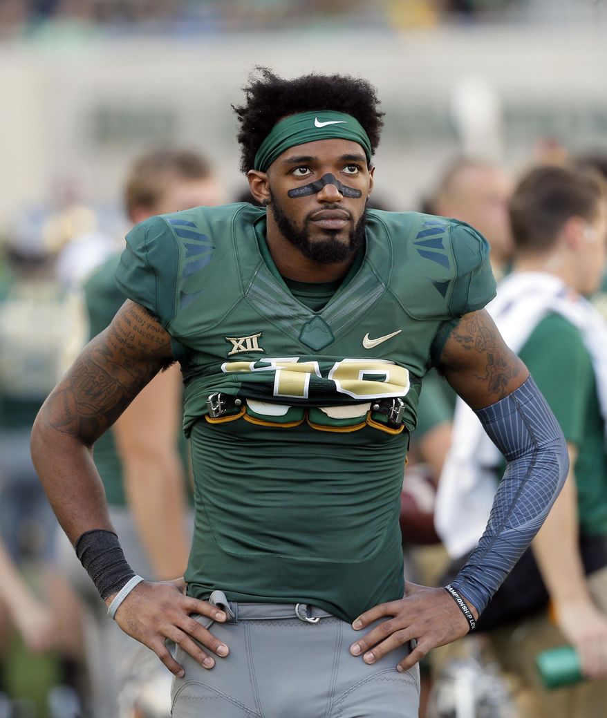 This Oct. 15, 2016 photo shows Baylor defensive back Travon Blanchard (48) walking along the sideline during an NCAA college football game against Kansas in Waco, Texas. Blanchard has been suspended after the school was notified that a protective order had been issued against him. The Baylor athletic department released a statement Tuesday, Feb. 28, 2017 saying it was aware of the complaint made by a woman against Blanchard through the McLennan County District Attorney’s Office. (AP Photo/Tony Gutierrez)