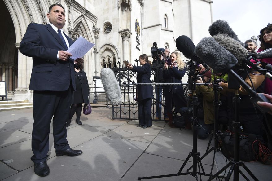 Managing Director of travel company Tui Nick Longman reads a statement abouta deadly gun attack in Tunisia outside the Royal Courts of Justice in London Tuesday Feb. 28, 2017 . The coroner said the Tunisian police response to a deadly gun attack on the beach resort of Sousse was "at best shambolic, at worst cowardly." Judge Nicholas Lorraine-Smith is delivering his findings Tuesday at an inquest into the deaths of 30 British tourists killed in the June 2015 attack at the five-star Riu Imperial Marhaba hotel. (Kirsty O'Connor/PA via AP)