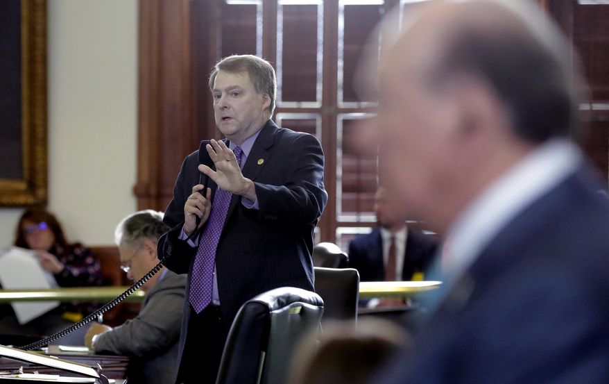 Texas Sen. Brian Birdwell, R-Granbury, left, debates a call for a "convention of states" that would amend the U.S. Constitution and impose things like a federal balanced budget requirement and term limits in the senate chamber, Tuesday, Feb. 28, 2017, in Austin, Texas. (AP Photo/Eric Gay)