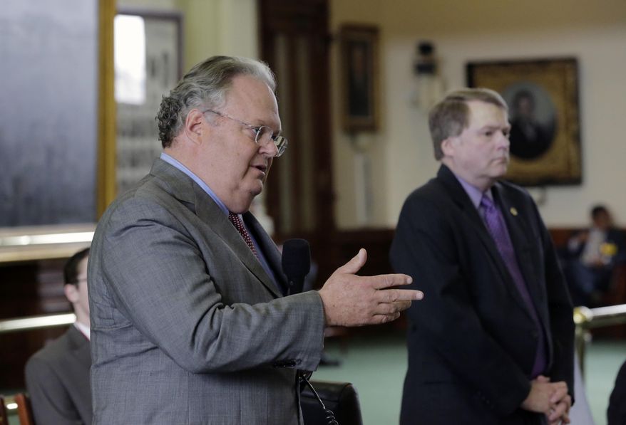 Sen. Craig Estes, R-Wichita Falls, left, offers an amendment during debate over a call for a "convention of states" that would amend the U.S. Constitution and impose things like a federal balanced budget requirement and term limits in the senate chamber, Tuesday, Feb. 28, 2017, in Austin, Texas. (AP Photo/Eric Gay)