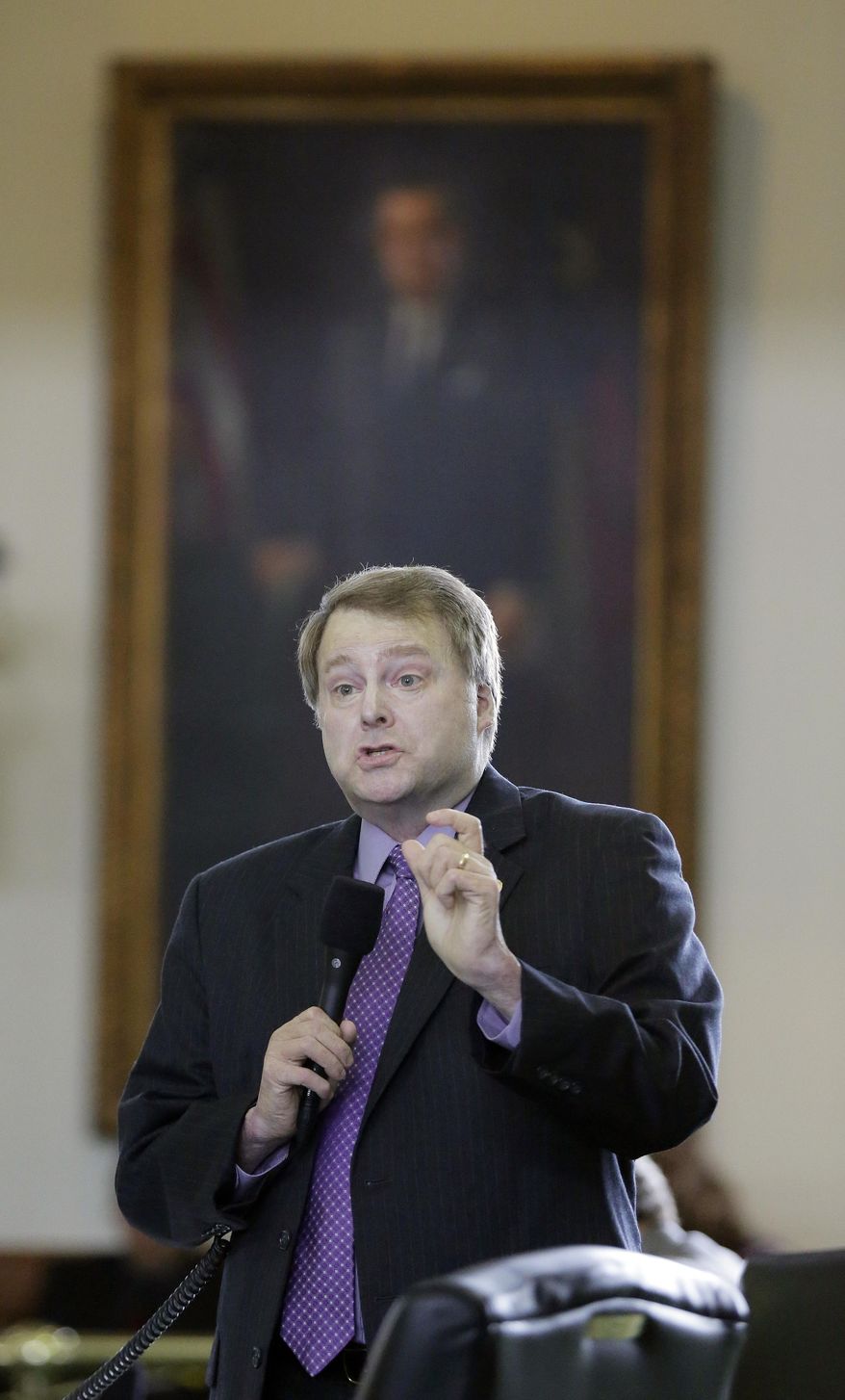 Texas Sen. Brian Birdwell, R-Granbury, left, debates a call for a "convention of states" that would amend the U.S. Constitution and impose things like a federal balanced budget requirement and term limits in the senate chamber, Tuesday, Feb. 28, 2017, in Austin, Texas. (AP Photo/Eric Gay)