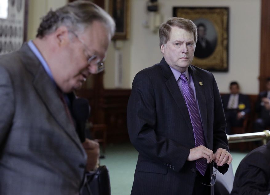 Texas Sen. Brian Birdwell, R-Granbury, right, listens to Sen. Craig Estes, R-Wichita Falls, left, as he offers an amendment during debate over a call for a "convention of states" that would amend the U.S. Constitution and impose things like a federal balanced budget requirement and term limits in the senate chamber, Tuesday, Feb. 28, 2017, in Austin, Texas. (AP Photo/Eric Gay)