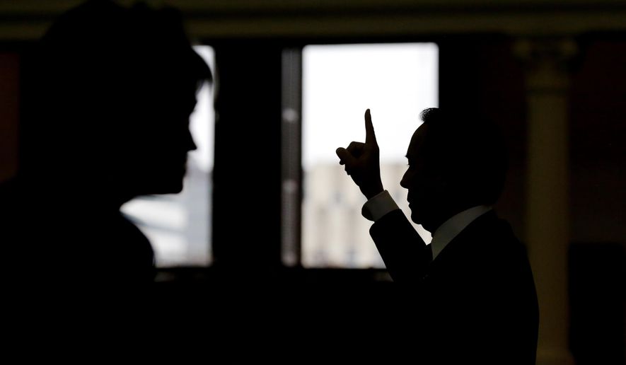 Texas Sen. Carlos Uresti, D-San Antonio, votes on an amendment during debate on a call for a "convention of states" that would amend the U.S. Constitution and impose things like a federal balanced budget requirement and term limits in the senate chamber, Tuesday, Feb. 28, 2017, in Austin, Texas. (AP Photo/Eric Gay)