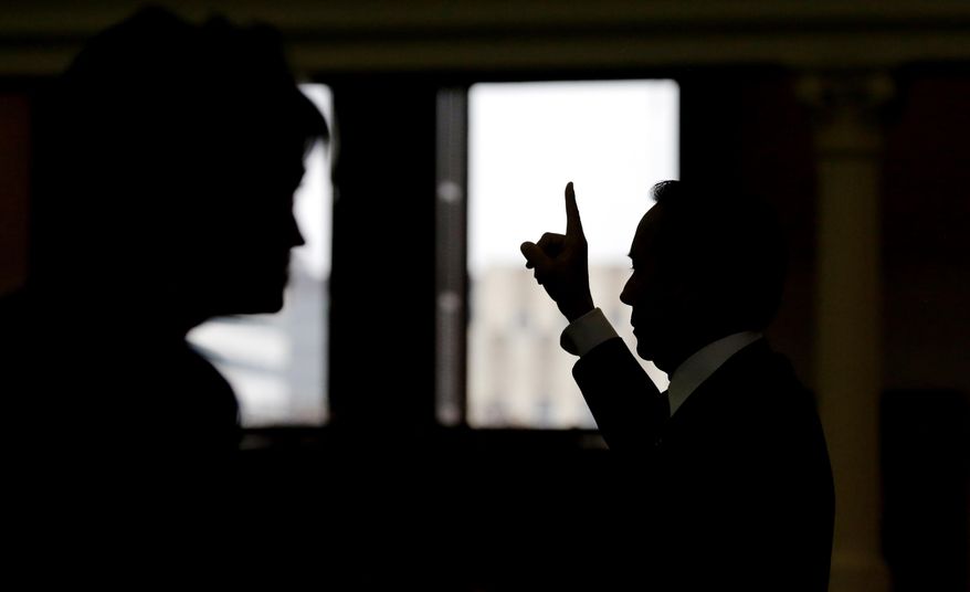 Texas Sen. Carlos Uresti, D-San Antonio, votes on an amendment during debate on a call for a "convention of states" that would amend the U.S. Constitution and impose things like a federal balanced budget requirement and term limits in the senate chamber, Tuesday, Feb. 28, 2017, in Austin, Texas. (AP Photo/Eric Gay)