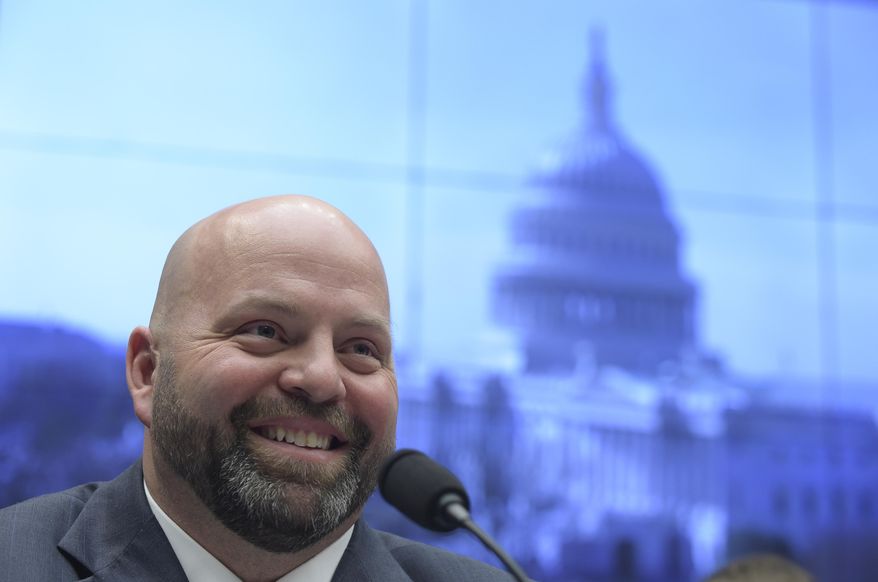 Olympic shot-put champion Adam Nelson testifies on Capitol Hill in Washington, Tuesday, Feb. 28, 2017, before the House Commerce Energy and Commerce subcommittee hearing on the international anti-doping system. (AP Photo/Susan Walsh)