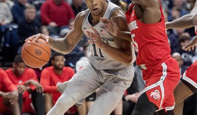 Penn State's Lamar Stevens dribbles around Ohio State's Kam Williams during an NCAA college game Tuesday, Feb. 28, 2017, in State College, Pa. (Abby Drey/Centre Daily Times via AP)