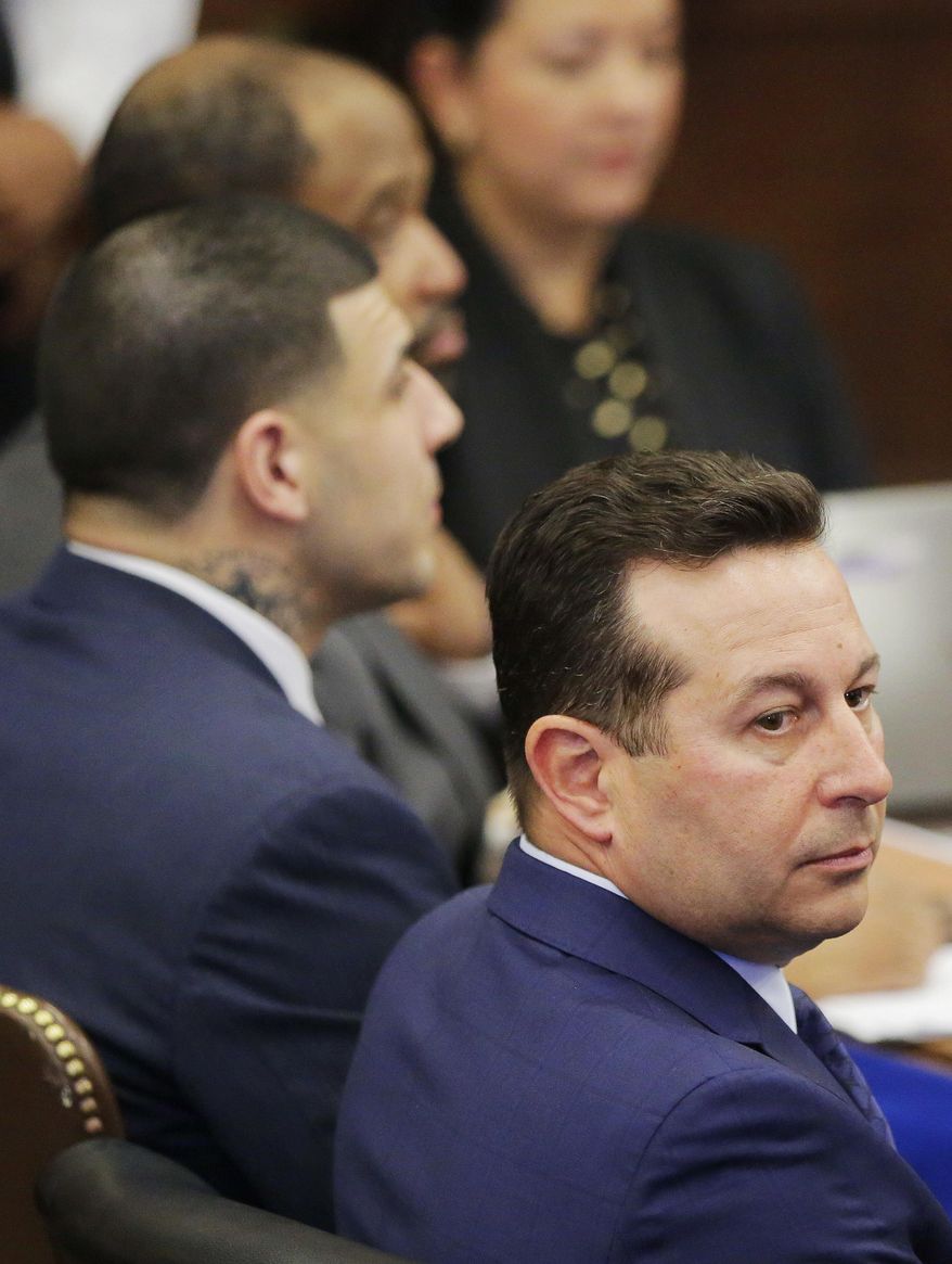 Former New England Patriots tight end Aaron Hernandez and his lead defense attorney Jose Baez, right, listen as the trial judge instructs the jury on the first day of Hernandez's double murder trial at Suffolk Superior Court Wednesday, March 1, 2017 in Boston. Hernandez is standing trial for the July 2012 killings of Daniel de Abreu and Safiro Furtado who he encountered in a Boston nightclub. He is already serving a life sentence in the 2013 killing of semi-professional football player Odin Lloyd. (AP Photo/Stephan Savoia, Pool)