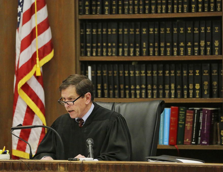 Judge Jeffrey Locke addresses former New England Patriots tight end Aaron Hernandez's defense attorneys at the start of the first day of his double murder trial at Suffolk Superior Court on Wednesday, March 1, 2017, in Boston. Hernandez is standing trial for the July 2012 killings of Daniel de Abreu and Safiro Furtado who he encountered in a Boston nightclub. He is already serving a life sentence in the 2013 killing of semi-professional football player Odin Lloyd. (AP Photo/Stephan Savoia, Pool)