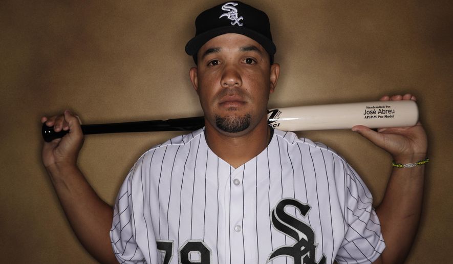 FILE - This is a Feb. 23, 2017, file photo showing Chicago White Sox' Jose Abreu posed during the team's photo day in Glendale, Ariz. Abreu is up next as a prosecution witness in the trial of a Florida sports agent and a baseball trainer accused of smuggling Cuban players from the communist island. Abreu is scheduled to testify Wednesday, March 1, 2017, in the case against agent Bartolo Hernandez and trainer Julio Estrada. (AP Photo/Morry Gash, File)