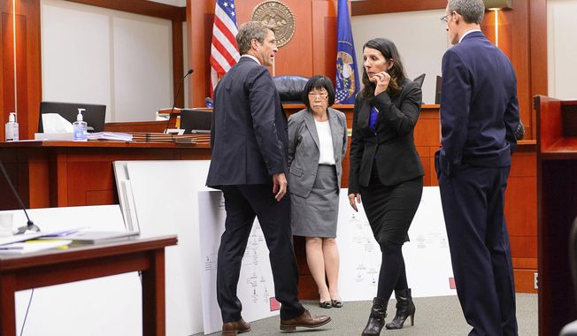 Defense attorney Scott C. Williams, Salt Lake County prosecutor Chou Chou Collins, defense attorney Cara Tangaro and Assistant Salt Lake County District Attorney Fred Burmester, look over exhibits during former Utah Attorney General John Swallow&#x27;s trial in Salt Lake City, Tuesday, Feb. 28, 2017. Swallow presented a brief defense Tuesday as one of the biggest political scandals in state history sped toward jury deliberations. (Trent Nelson/The Salt Lake Tribune via AP, Pool)