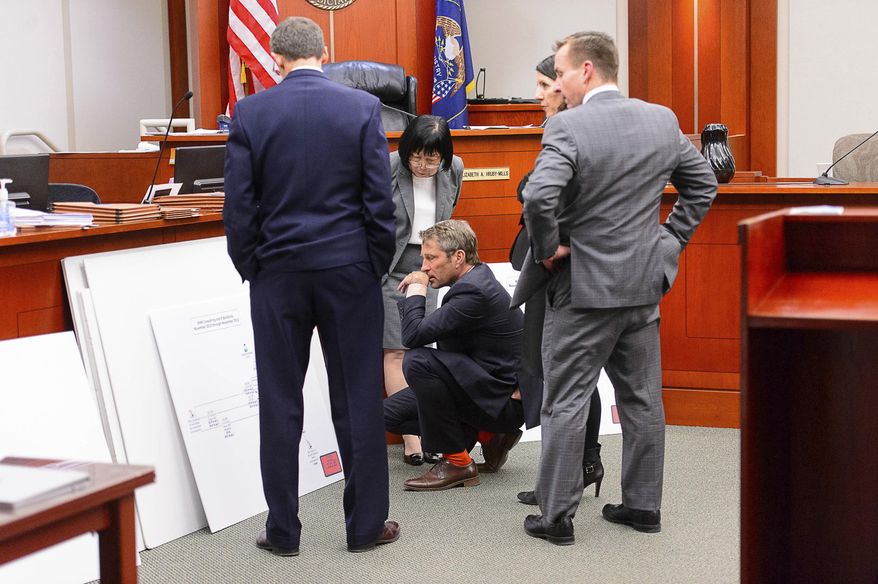 Attorneys look over exhibits during former Utah Attorney General John Swallow's trial in Salt Lake City, Tuesday, Feb. 28, 2017. Swallow presented a brief defense Tuesday as one of the biggest political scandals in state history sped toward jury deliberations. (Trent Nelson/The Salt Lake Tribune via AP, Pool)