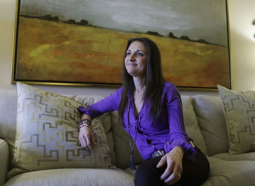 In a photo from, Tuesday, Feb. 21, 2017, spiritual medium Rebecca Rosen is interviewed in Birmingham, Mich. Rosen wants to channel her ability to see dead people into helping readers navigate their daily lives. "What the Dead Have Taught Me About Living Well" is Rosen's new book in which she conveys the insights she has gained from two decades of communicating with angels and guides from the "other side" and how she incorporates that guidance into her own life. (AP Photo/Carlos Osorio)