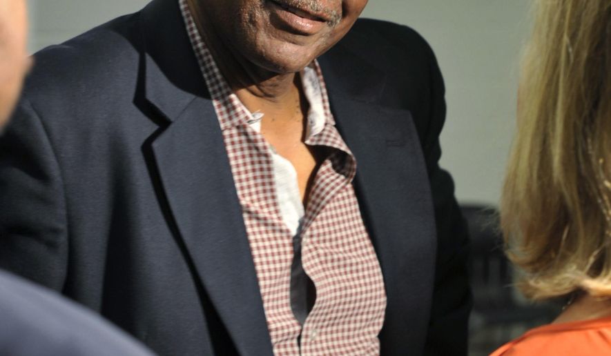 FILE - In this May 29, 2013, file photo. former Cleveland Browns wide receiver Reggie Rucker chats after a news conference for Hall of Fame running back Jim Brown in Cleveland. Federal prosecutors say Rucker owes more than $110,000 for stealing from two charities, and they want to garnish his earnings from the NFL for restitution.Cleveland.com reports that could include his pension and any money he might receive from a nearly $1 billion class-action settlement that the NFL agreed to pay to athletes who suffered concussions. Players have months to submit claims in that settlement. Rucker’s attorney says the imprisoned 69-year-old intends to use settlement money as restitution. (AP Photo/David Richard, File)