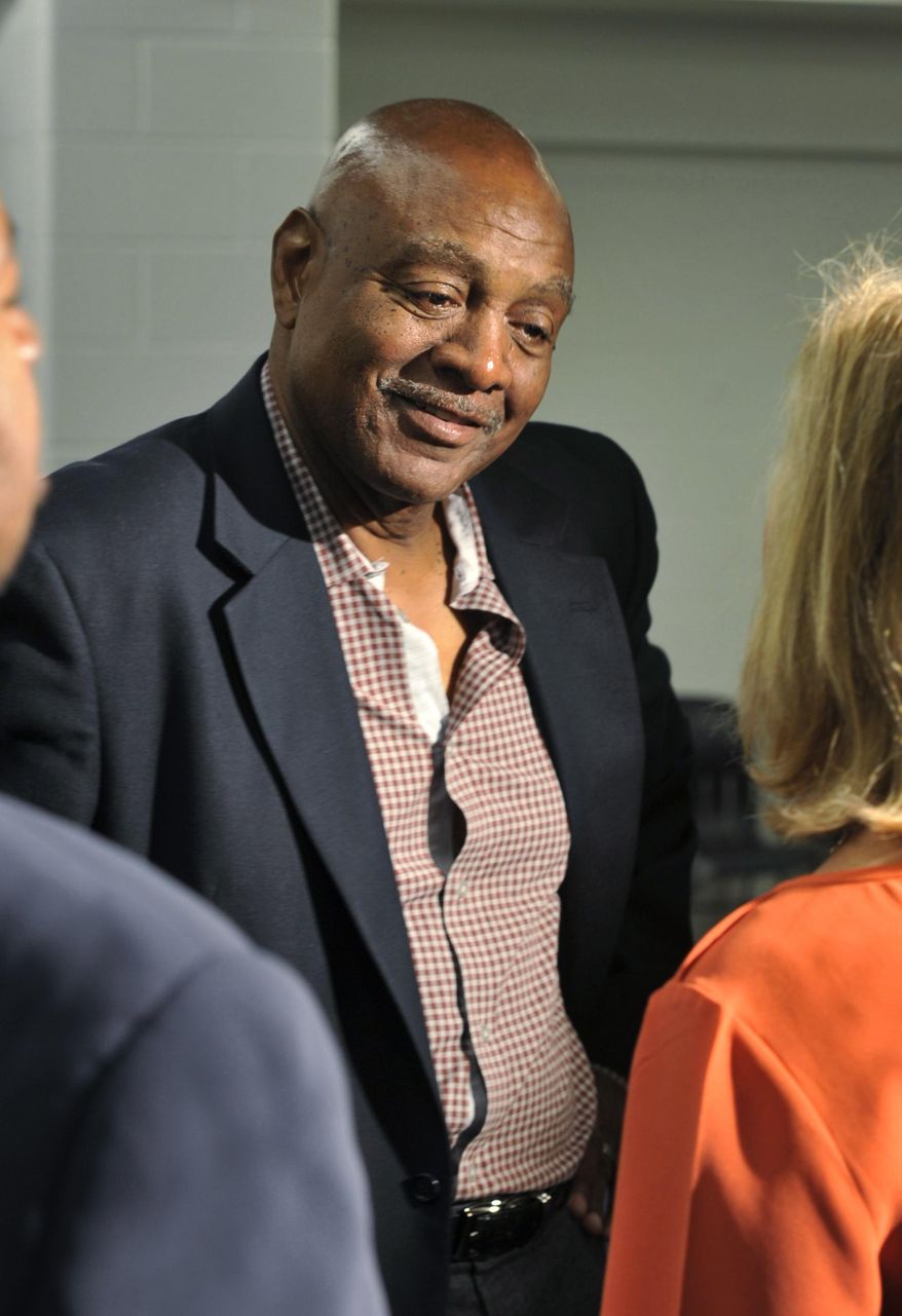 FILE - In this May 29, 2013, file photo. former Cleveland Browns wide receiver Reggie Rucker chats after a news conference for Hall of Fame running back Jim Brown in Cleveland. Federal prosecutors say Rucker owes more than $110,000 for stealing from two charities, and they want to garnish his earnings from the NFL for restitution.Cleveland.com reports that could include his pension and any money he might receive from a nearly $1 billion class-action settlement that the NFL agreed to pay to athletes who suffered concussions. Players have months to submit claims in that settlement. Rucker’s attorney says the imprisoned 69-year-old intends to use settlement money as restitution. (AP Photo/David Richard, File)