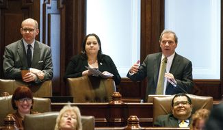 Illinois Senate President John Cullerton, right, answers questions about a piece of the bipartisan grand bargain budget deal during floor debate Tuesday, Feb. 28, 2017, at the Capitol in Springfield, Ill. (Rich Saal/The State Journal-Register via AP)