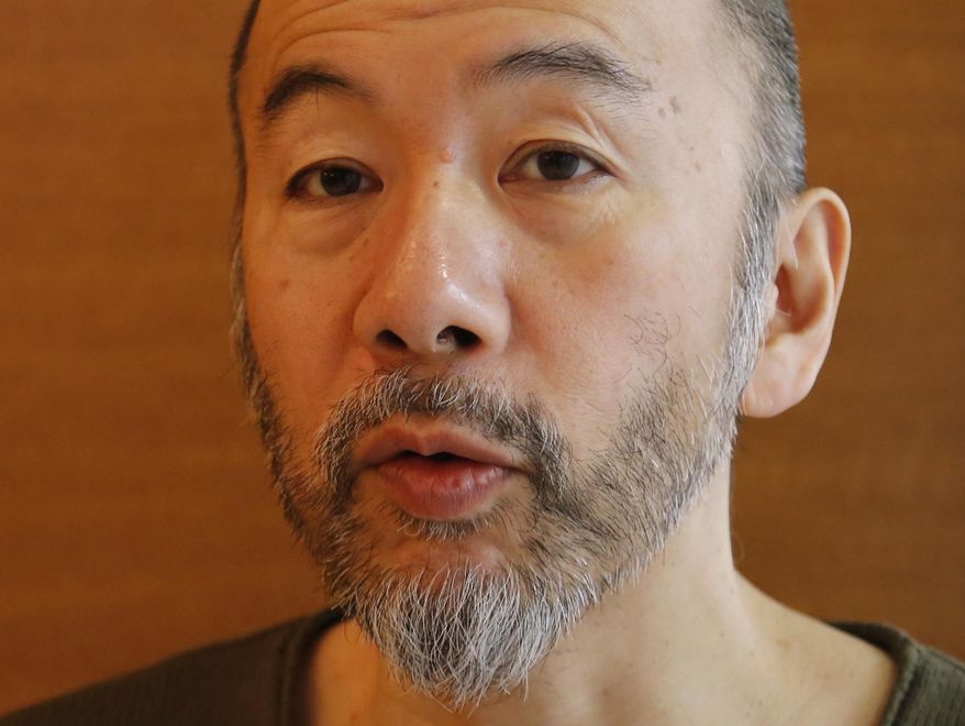 In this Feb. 16, 2017 photo, Japanese film director Shinya Tsukamoto speaks during an interview in Tokyo. Violence pulsates in Tsukamoto’s early films, driving stories into nightmarish fantasies like in 1989’s “Tetsuo,” which ridicules middle-class conformity with a man-becomes-machine metamorphosis. The nature of violence changed in his more recent films, from whimsical “cyberpunk” horror to horrifying reality. In the interview, he says that’s why he identified so closely with Martin Scorsese’s “Silence,” in which he plays a Christian martyr in samurai-era Japan. (AP Photo/Yuri Kageyama)