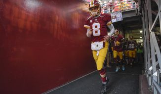 FILE - In this Jan. 1, 2017, file photo, Washington Redskins quarterback Kirk Cousins (8) runs onto the field before an NFL football game against the New York Giants in Landover, Md. The NFL salary cap for the upcoming season will be $167 million per team, up more than $12 million over last year. This is the fourth consecutive year the cap has risen at least $10 million. (AP Photo/Nick Wass, File)