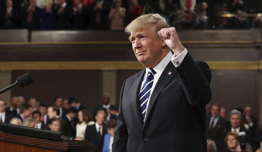 President Donald Trump gestures as he arrives on Capitol Hill in Washington, Tuesday, Feb. 28, 2017, for his address to a joint session of Congress. (Jim Lo Scalzo/Pool Image via AP)