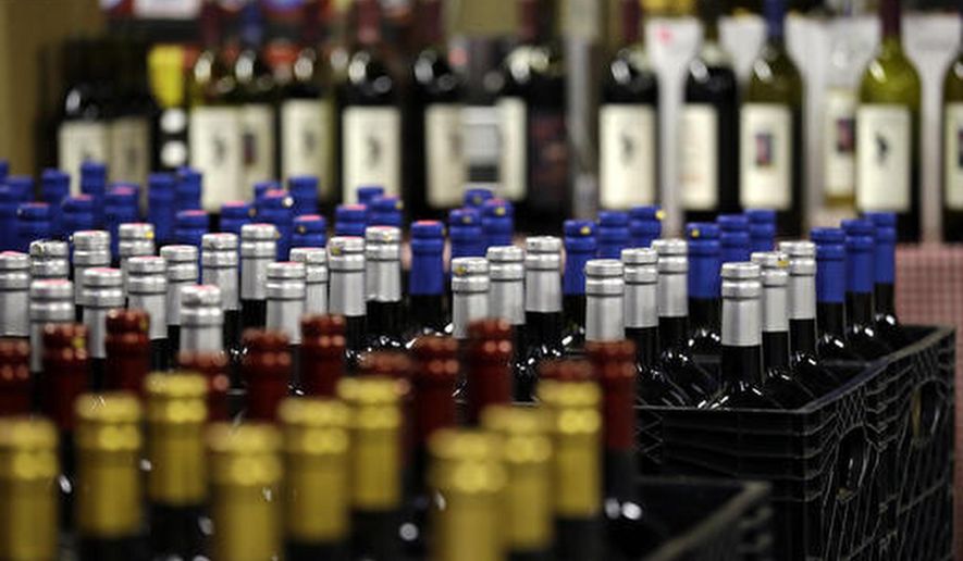 FILE - In this file photo taken Tuesday, Jan. 10, 2017, growlers of wine set to be shipped to retail outlets are on display at Wilridge Winery in Seattle. The state of Washington produced a record harvest of wine grapes in 2016. The Washington Wine Commission reported Wednesday, March 1, that the 2016 harvest was 270,000 tons, up 22 percent from the previous year. (AP Photo/Elaine Thompson, File)