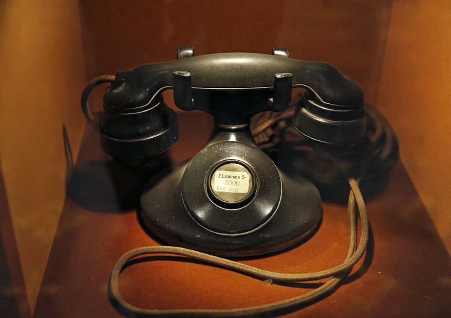 An vintage telephone is displayed behind glass inside the Waldorf Astoria hotel, Tuesday, Feb. 28, 2017, in New York. The Waldorf Astoria's history dates to 1893, but its original home was torn down to make way for the Empire State Building. The "new" Waldorf Astoria's more than 40 stories opened on Park Avenue in 1931, built at a cost topping $40 million ($639 million in today's dollars) making it one of the world's largest and most expensive hotels at the time. (AP Photo/Kathy Willens)