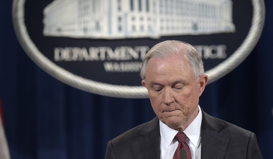 Attorney General Jeff Sessions pauses during a news conference at the Justice Department in Washington, Thursday, March 2, 2017. Sessions said he will recuse himself from a federal investigation into Russian interference in the 2016 White House election. (AP Photo/Susan Walsh)