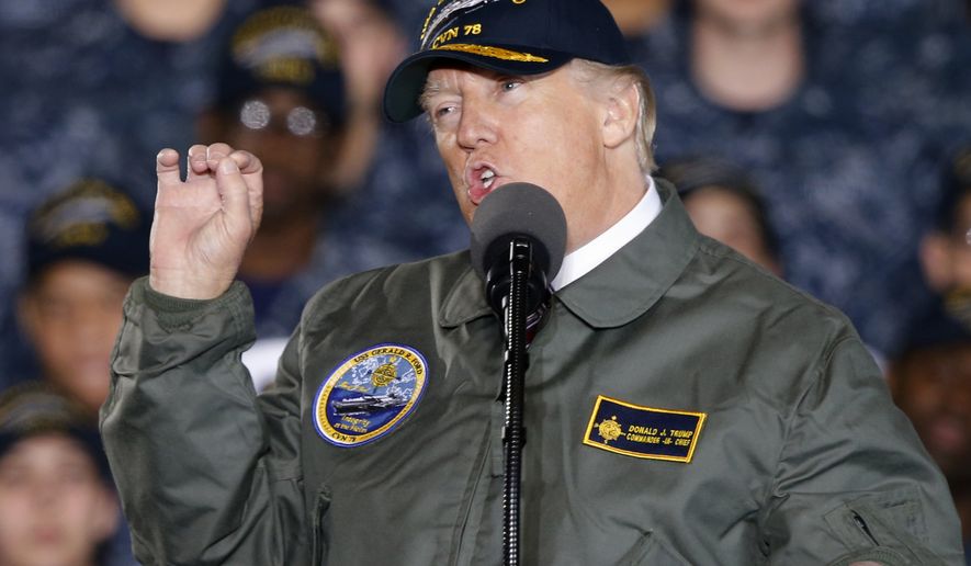 President Donald Trump gestures as he speaks to Navy and shipyard personnel aboard nuclear aircraft carrier Gerald R. Ford at Newport News Shipbuilding in Newport News, Va., Thursday, March 2, 2017. The ship which is still under construction is due to be delivered to the Navy later this year. (AP Photo/Steve Helber)