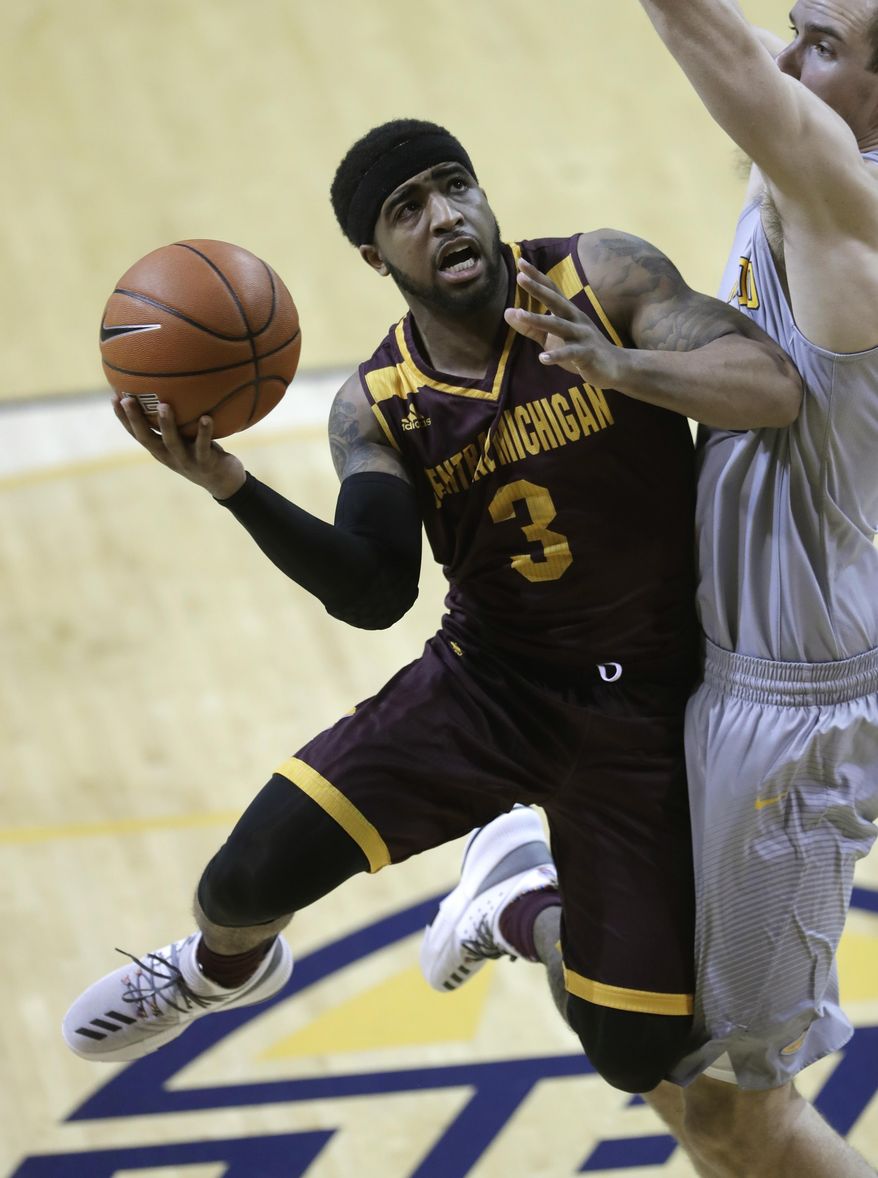In this Friday, Feb. 24, 2017 photo, Central Michigan University guard Marcus Keene shoots during an NCAA college basketball game against Toledo in Toledo, Ohio. Keene, Central Michigan's scoring machine, has a chance to have college basketball’s highest scoring average since Charlie Jones put up 30-plus points a game 20 years ago at Long Island University. (AP Photo/Carlos Osorio)