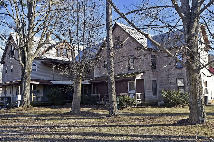 ADVANCE FOR SATURDAY MARCH 4 AND THEREAFTER - Seen in a Feb. 20, 2017 photo, the former Veil Maternity Hospital for unmarried women on East Main Street in Corry, Pa., is now an apartment complex. Veil hospitals offered the babies born there for adoption. (Dave Munch/Erie Times-News via AP)
