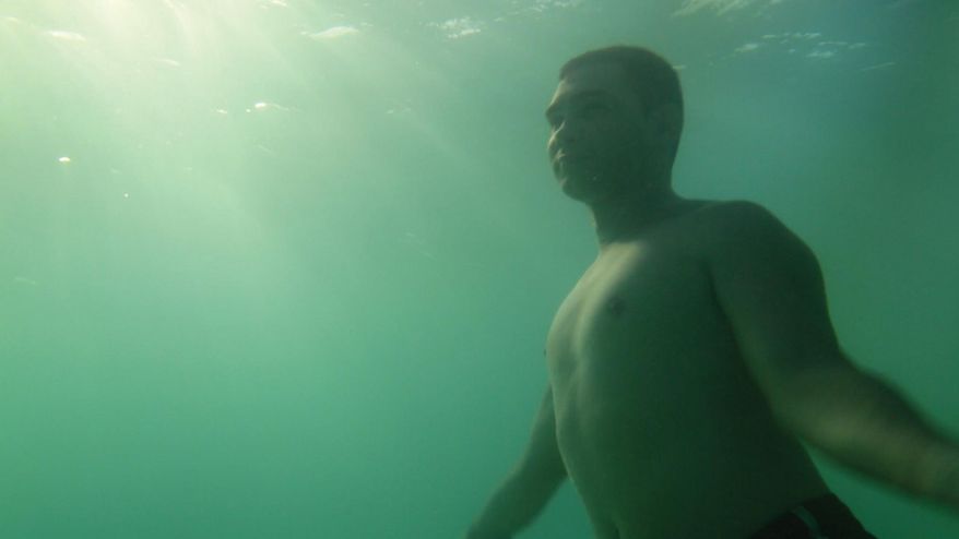 This image released by the Tribeca Film Festival shows Elian Gonzalez swimming in the Cuban sea in a scene from the Alex Gibney-produced documentary "Elian," which will premiere at the Tribeca Film Festival. (Ross McDonnell/Tribeca Film Festival via AP)