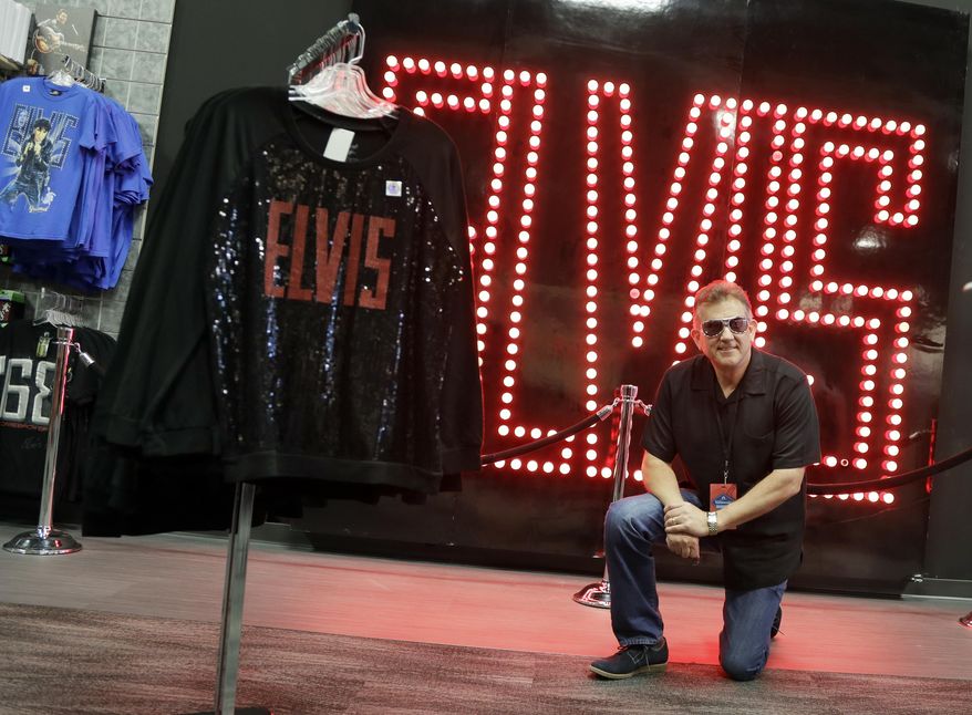 Bruce Lutes, of Danville, Ill., poses for a photo in a souvenir shop as he visits the "Elvis Presley's Memphis" complex Thursday, March 2, 2017, in Memphis, Tenn. Lutes, a lifelong Elvis fan, said the trip to Graceland was a Christmas gift from his wife. (AP Photo/Mark Humphrey)