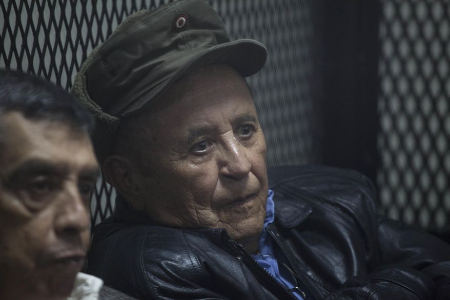 Francisco Gordillo Martinez, right, a former army officer, sits in a cell as he waits for a judge at a courtroom in Guatemala City, Thursday, March 2, 2017. Gordillo Martinez and four other high-ranking military officers will stand trial for the kidnapping and disappearance of then 14-year-old boy Marco Antonio Molina Theissen and the illegal detention, torture and rape of his sister in 1981. (AP Photo/Moises Castillo)