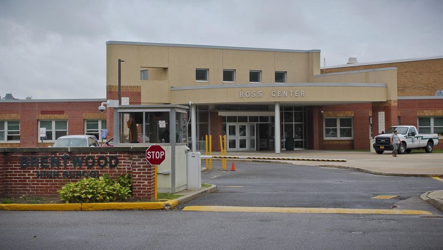 FILE - This file photo taken Monday, Sept. 26, 2016, shows the exterior of Brentwood High School in Brentwood, N.Y. where police were investigating the discovery of the remains of multiple Brentwood High School students in previous weeks. Federal agents said Thursday March 2, 2017, that they have caught the members of a violent El Salvadoran street gang who killed three teenagers last year, including two girls who were inseparable best friends at the high school. (AP Photo/Frank Eltman, File)