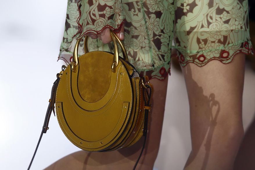 A model wears a creation by fashion designer Clare Waight Keller for Chloe's Fall-Winter 2017-2018 ready to wear fashion collection presented in Paris, Thursday, March 2, 2017. (AP Photo/Francois Mori)