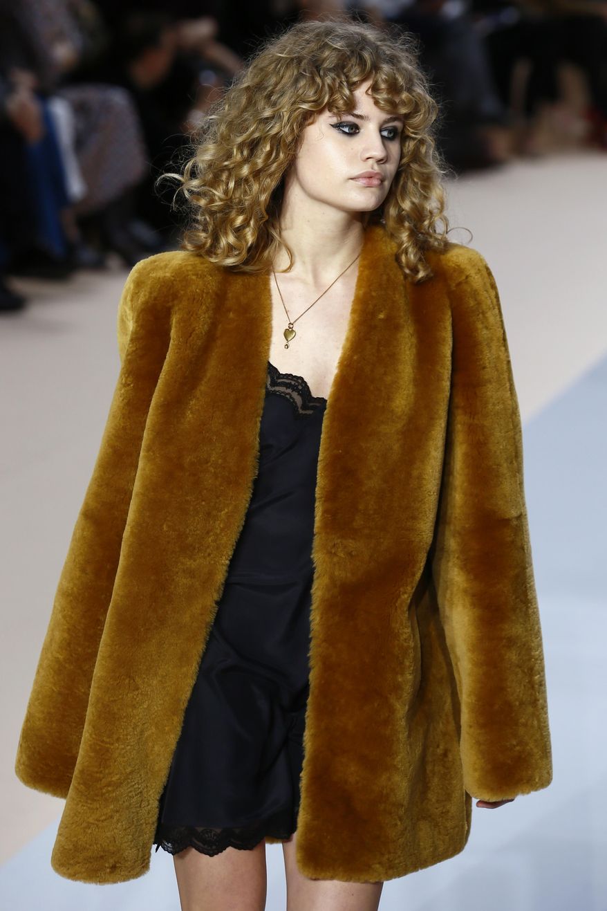 A model wears a creation by fashion designer Clare Waight Keller for Chloe's Fall-Winter 2017-2018 ready to wear fashion collection presented in Paris, Thursday, March 2, 2017. (AP Photo/Francois Mori)