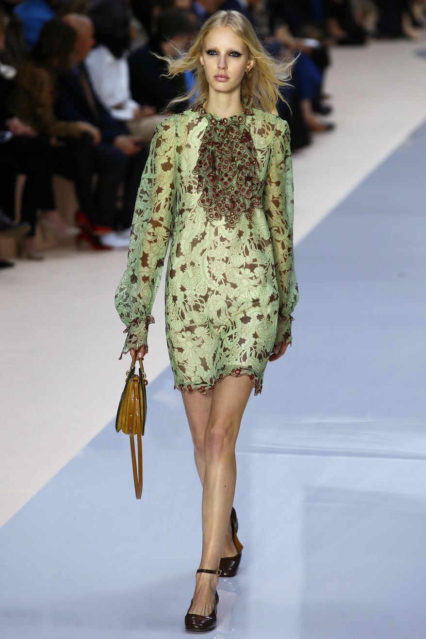 A model wears a creation by fashion designer Clare Waight Keller for Chloe's Fall-Winter 2017-2018 ready to wear fashion collection presented in Paris, Thursday, March 2, 2017. (AP Photo/Francois Mori)